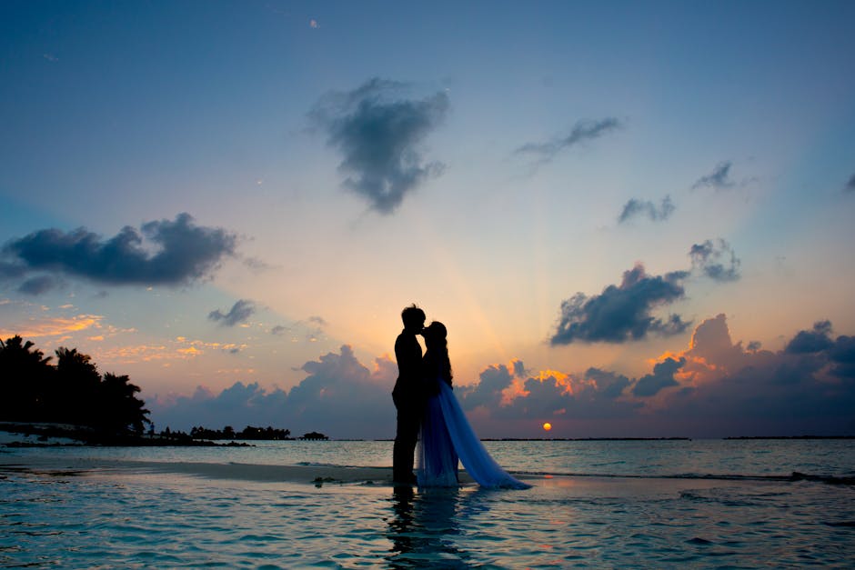 Romantic wedding couple enjoying a beautiful sunset